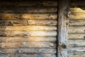 Modern Hand Hewn Natural Log Cabin Wall Facade Fragment Texture. Rustic Log Wall Horizontal Timber Background. Planed