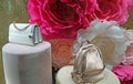 Modern handbags in a shop window on background of roses. Oroton is an Australian luxury fashion accessories company Royalty Free Stock Photo