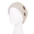 Modern handmade woollen knitted headband on a white Doll head