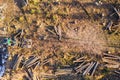 Modern harvester machine and a felled forest from above in winter Royalty Free Stock Photo