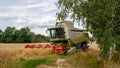 Modern harvester at work in field during wheat Royalty Free Stock Photo