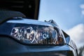 Modern headlight on a old BMW car