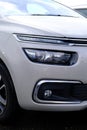 Modern headlights with a complex design and construction. Close-up of the front of the car Royalty Free Stock Photo