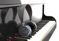 Modern headphone on piano keyboard against the light 3d illustr
