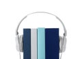 Modern headphones with hardcover books on white background Royalty Free Stock Photo