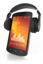 Modern headphones on musical smartphone Royalty Free Stock Photo