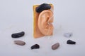 Modern hearing aids on white background Royalty Free Stock Photo