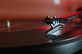 Modern high quality turntable record player playing a vinyl analogue music LP with red back light Royalty Free Stock Photo