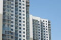 Modern high-rise apartment building at blue sky background Royalty Free Stock Photo