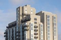 Modern high rise apartment building in cubist style against a blue sky Royalty Free Stock Photo