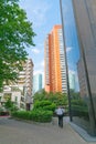 Modern high-rise buildings tower above street below Royalty Free Stock Photo