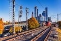 Modern high-speed train moves on the business center background. Royalty Free Stock Photo