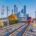 Modern high-speed train moves on the business center background Royalty Free Stock Photo