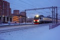 Modern high-speed train moves at high speed in the winter morning Royalty Free Stock Photo