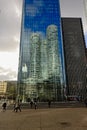 Highrise tower reflecting in the windows of another tower at La Defense busines district, paris, france
