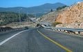 Modern highway curving through mountainous terrain
