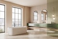 Modern home bathroom interior with bathtub and sink, panoramic window Royalty Free Stock Photo