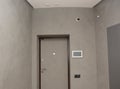 Modern house entrance metal door interior with smart house system, security camera, smoke alarms and fire detection