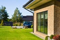 Modern house side yard with large garden window