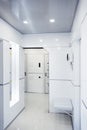 Modern home hallway interior. White plactic panels and tiles. Futuristic interior concept design. Space ship at home. Royalty Free Stock Photo