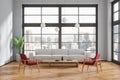 Modern home living room interior with sofa and armchairs, panoramic window Royalty Free Stock Photo