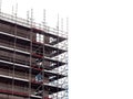 Modern home of office building construction with scaffolding. White background. New house development. Construction industry Royalty Free Stock Photo