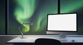 Modern home office desk with computer and aurora borealis view at night. Royalty Free Stock Photo