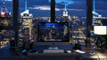 modern home office setup with imac, night time, city skyline on the screen Royalty Free Stock Photo