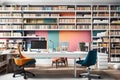 A modern home office setup with a sleek desk, ergonomic chair, and a wall of bookshelves filled with colorful binders and