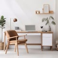 Modern home office with wooden desk and office chair against of white wall. Scandinavian interior design of modern living room Royalty Free Stock Photo