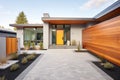 modern home with sleek paving stones leading to the entrance