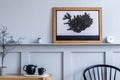 Modern home staging of living room with design chair, wooden console, mock up poster map.