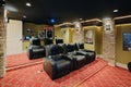 A modern home theater with comfortable seating.