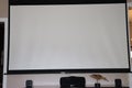 Modern home theater system with 100 inch projector screen, surround sound speakers, and a wood bird Royalty Free Stock Photo