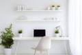 Modern home workspace with ergonomic furniture and minimalist design, ideal for remote work. Comfortable and stylish Royalty Free Stock Photo