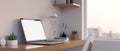 Modern home workstation interior design with laptop mockup and accessories on wood worktable Royalty Free Stock Photo