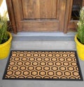 Modern Honeycomb design peach color doormat with black border Placed outside door