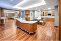 modern hospital with warm, natural accents, such as wooden furniture and stone floors