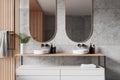 Modern hotel bathroom interior with double sink and accessories, dresser Royalty Free Stock Photo
