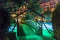 Modern hotel or house with a dark blue water swimming pool at night. Stuff clean pool at night. Royalty Free Stock Photo