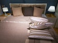 Modern hotel room interior - bed and pillows Royalty Free Stock Photo