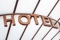 Modern hotel sign over glass canopy entrance