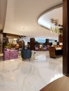 Modern hotel vestibule and a luxurious restaurant in the center with neon lighting