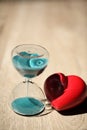 Modern hourglass and red heart with copy space. Royalty Free Stock Photo