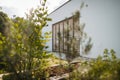 Modern house with beautiful garden and wooden gate, side outdoor view. Royalty Free Stock Photo