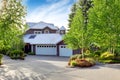 Modern house exterior with curb appeal. View of garage and spacious driveway Royalty Free Stock Photo