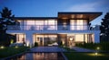 Modern house exterior evening view with interior lighting Royalty Free Stock Photo