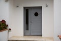 Modern house facade with contemporary grey entrance door