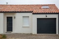 Modern house facade with contemporary grey garage roll gate sectional door