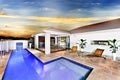 Modern house or hotel with a blue water swimming pool Royalty Free Stock Photo